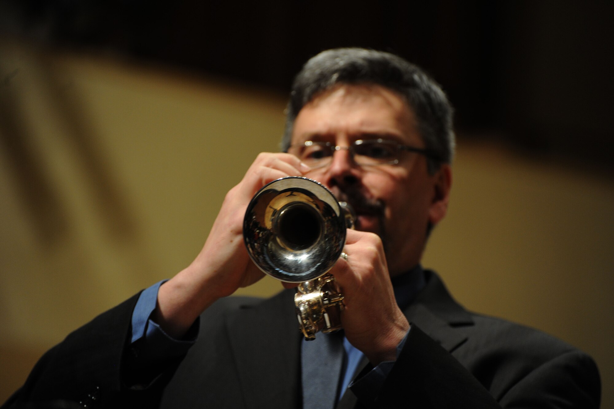 Former Air Force bandsman Robert Sullivan plays the trumpet during a performance by the U.S. Air Force Band at Northwestern University in Evanston, Ill., April 6, 2014. The U.S. Air Force Band commander invited Sullivan, a professor of trumpet at Northwestern University, to be a guest performer during the performance. (U.S. Air Force photo/Master Sgt. Tammie Moore)
