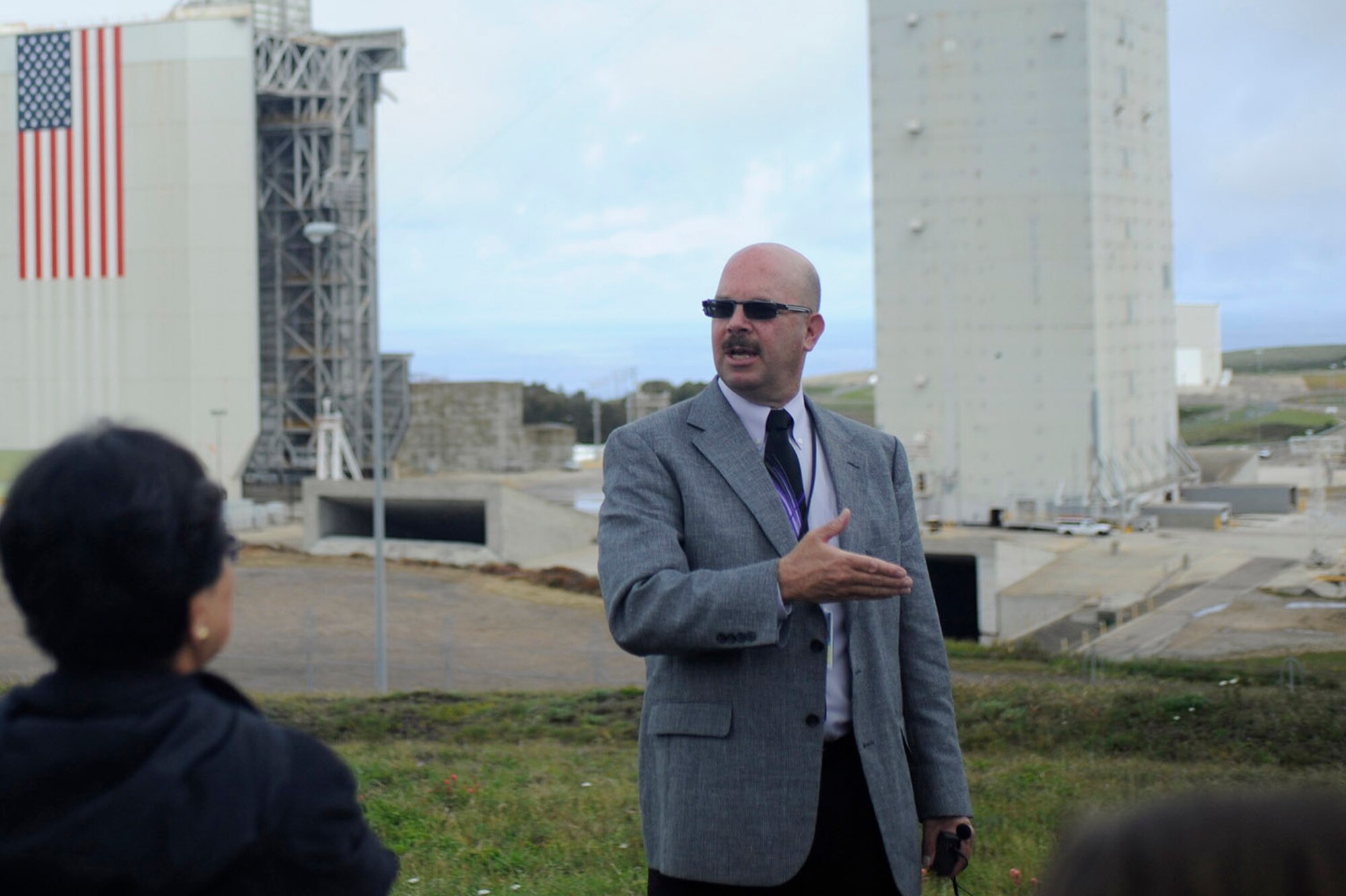 Larry Hill, 30th Space Wing Public Affairs chief of community relations, explains Vandenberg's mission during a public tour at Space Launch Complex-6, April 11, 2012, Vandenberg Air Force Base, Calif. Although VAFB’s current rapport with the local communities is strong, preserving resilient connections and understandings is essential. (U.S. Air Force photo/Staff Sgt. Andrew Satran)
