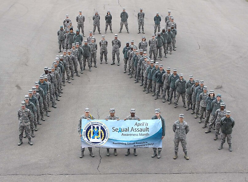 Students from the U.S. Air Force School of Aerospace Medicine form a symbolic human ribbon to show their solidarity for Air Force efforts to end sexual assault.  April is Sexual Assault Awareness Month. (Photo by Tara Dixon Engel)

