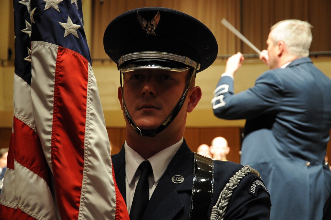 A U.S. Air Force Honor Guard Airman presents the colors  at the beginning of the U.S. Air Force Band’s performance at Northwestern University in Evanston, Ill., April 6, 2014. (U.S. Air Force photo/Master Sgt. Tammie Moore)