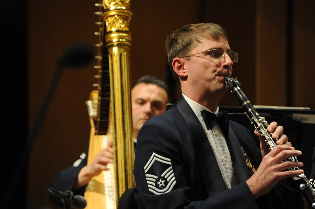 Senior Master Sergeants Eric Sabatino (left) and Brian McCurdy perform with the U.S. Air Force Band at Northwestern University in Evanston, Ill., April 6, 2014. Sabatino, a native of New York City, is a harp soloist for the Concert Band and Symphony Orchestra. McCurdy, a native of Virginia Beach, Va., is a clarinetist with the Concert Band, the Band’s largest ensemble. (U.S. Air Force photo/Master Sgt. Tammie Moore)
