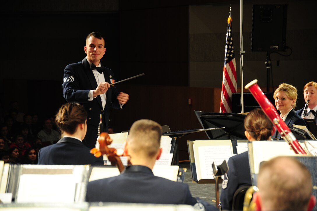 Tech. Sgt. Joseph Bello serves as a guest conductor for The U. S. Air Force Band performance at Neuqua Valley High School in Naperville, Ill, April 5, 2014. Bello, a Neuqua Valley graduate, is an euphoniumist and director of Concert Band tours. (U. S. Air Force photo/Airman 1st Class Joshua R. M. Dewberry)