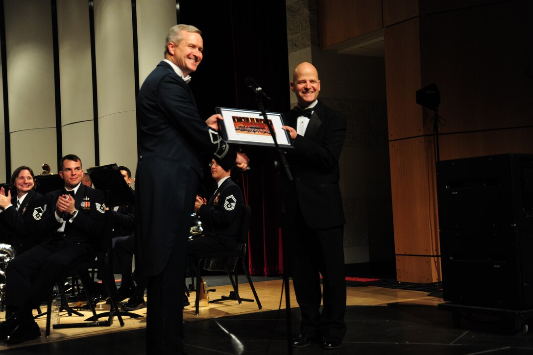 Col. Larry Lang, The U.S. Air Force Band commander and conductor, and Charles Staley, Neuqua Valley High School director of bands, pose for a photo at Neuqua Valley High School concert in Naperville, Ill, April 5, 2014. Staley guest conducted the Band along with a group of his students for the concert. (U. S. Air Force Photo/Airman 1st Class Joshua R. M. Dewberry)