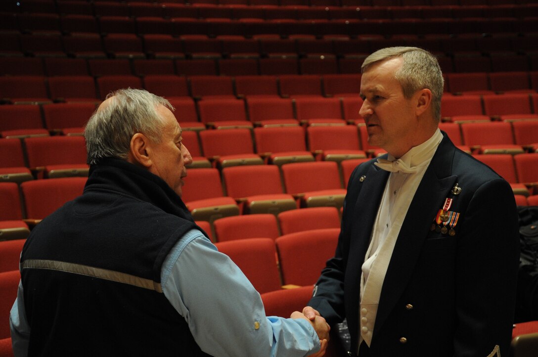 Col. Larry Lang speaks with a member of the audience after a performance by the U.S. Air Force Band at Northwestern University in Evanston, Ill., April 6, 2014. Lang is the commander and conductor of the Band. (U.S. Air Force photo/Master Sgt. Tammie Moore)
