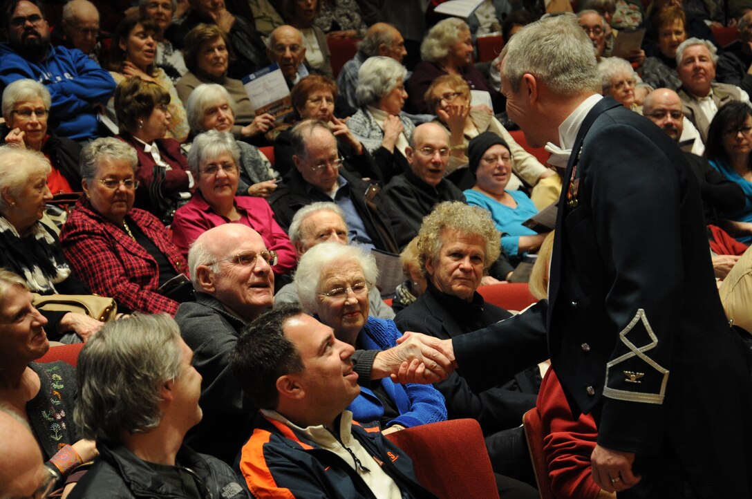 Col. Larry Lang talks to members of the audience before a performance by the U.S. Air Force Band at Northwestern University in Evanston, Ill., April 6, 2014. Lang is the commander and conductor of the USAF Band. (U.S. Air Force photo/Master Sgt. Tammie Moore)
