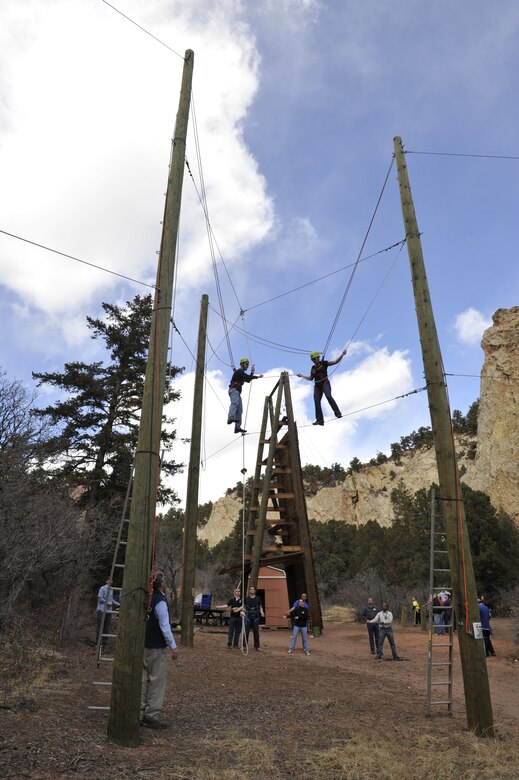 COLORADO SPRINGS, Colo. – Participants in a Peterson Air Force Base Chapel sponsored Rebound retreat use communication techniques to complete one of two ropes course events at Glen Eyrie March 28. The retreat focused on communication and conflict resolution. (U.S. Air Force photo/Rob Bussard)