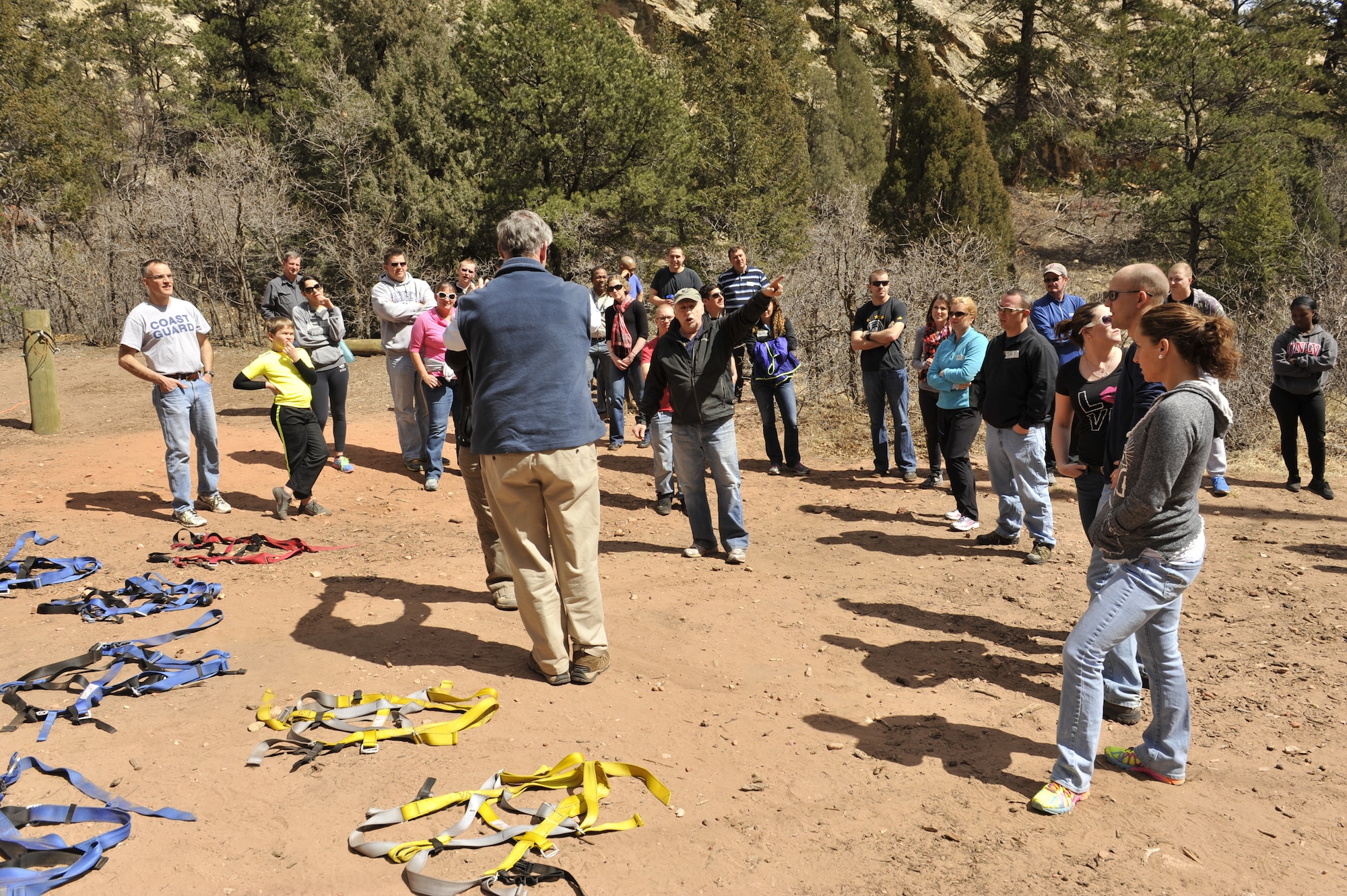 COLORADO SPRINGS, Colo. – A staff member from Glen Eyrie explains how the ropes course works to participants of a Peterson Air Force Base Chapel Rebound retreat March 28. The retreat focused on communication and conflict resolution. After the seminar, attendees participated in two events designed to foster communication and trust. (U.S. Air Force photo/Philip Carter)