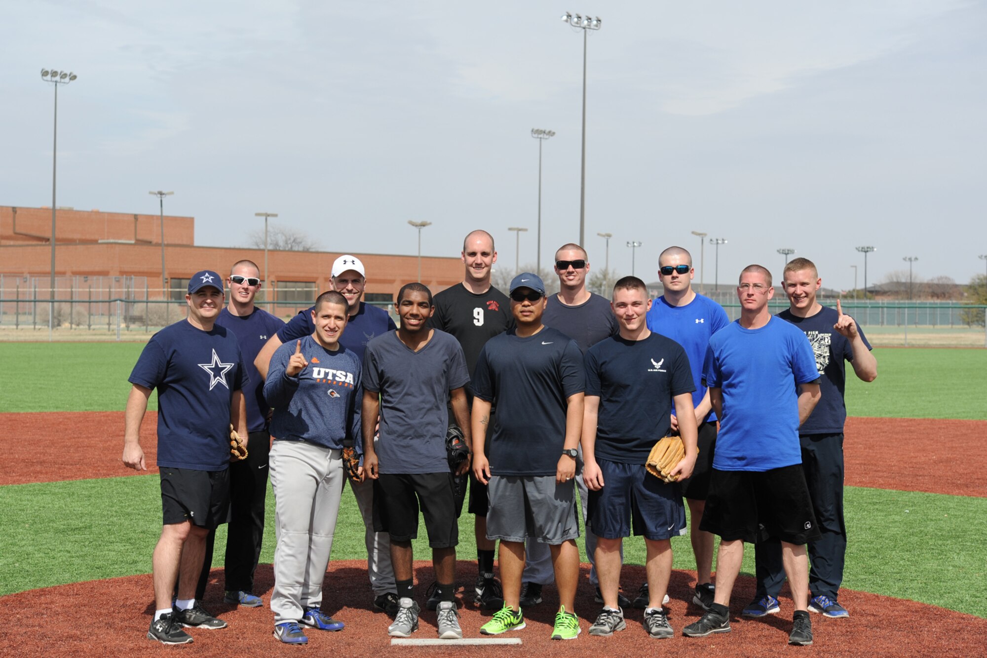 GOODFELLOW AIR FORCE BASE, Texas--  The 17th Contracting Squadron softball team pose for a photo after winning the Mathis Fitness Center multipurpose field grand opening tournament here March 21. The Office of the Secretary of Defense Fitness Program funded the new multipurpose field in 2012, with residual funds from the drawdown of overseas troops, which was used to meet Department of Defense wellness initiatives. (U.S. Air Force photo/Senior Airman Michael Smith)
