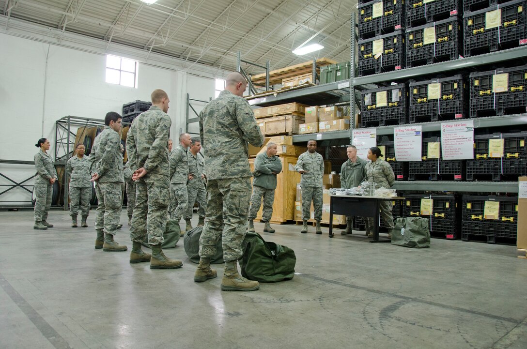 Lt. Gen. Darren McDew, Commander of the 18th Air Force, tours the mobility processing area of the 126th Logistics Readiness Squadron during a visit to the 126th Air Refueling Wing, Scott Air Force Base, Ill., March 1, 2014. (Air National Guard photo by Senior Airman Andrew Kleiser)