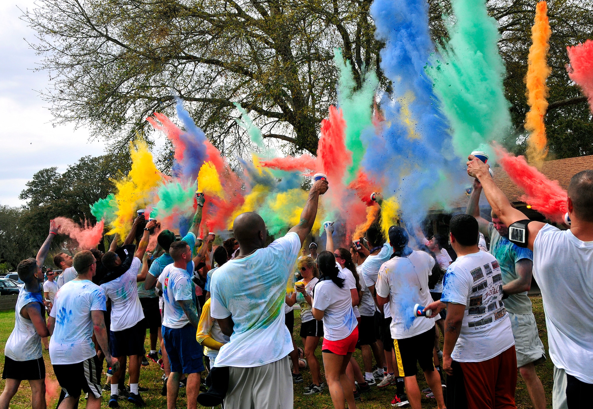 Participants get colorful during the Color Me Aware fun run April 4, at Eglin Air Force Base, Fla.  Approximately 30 volunteers helped more than 450 participants get colorful during three color zones of the three-mile run.  The event highlighted the start of Sexual Assault Awareness Month. (U.S. Air Force photo/Tech. Sgt. Cheryl Foster)