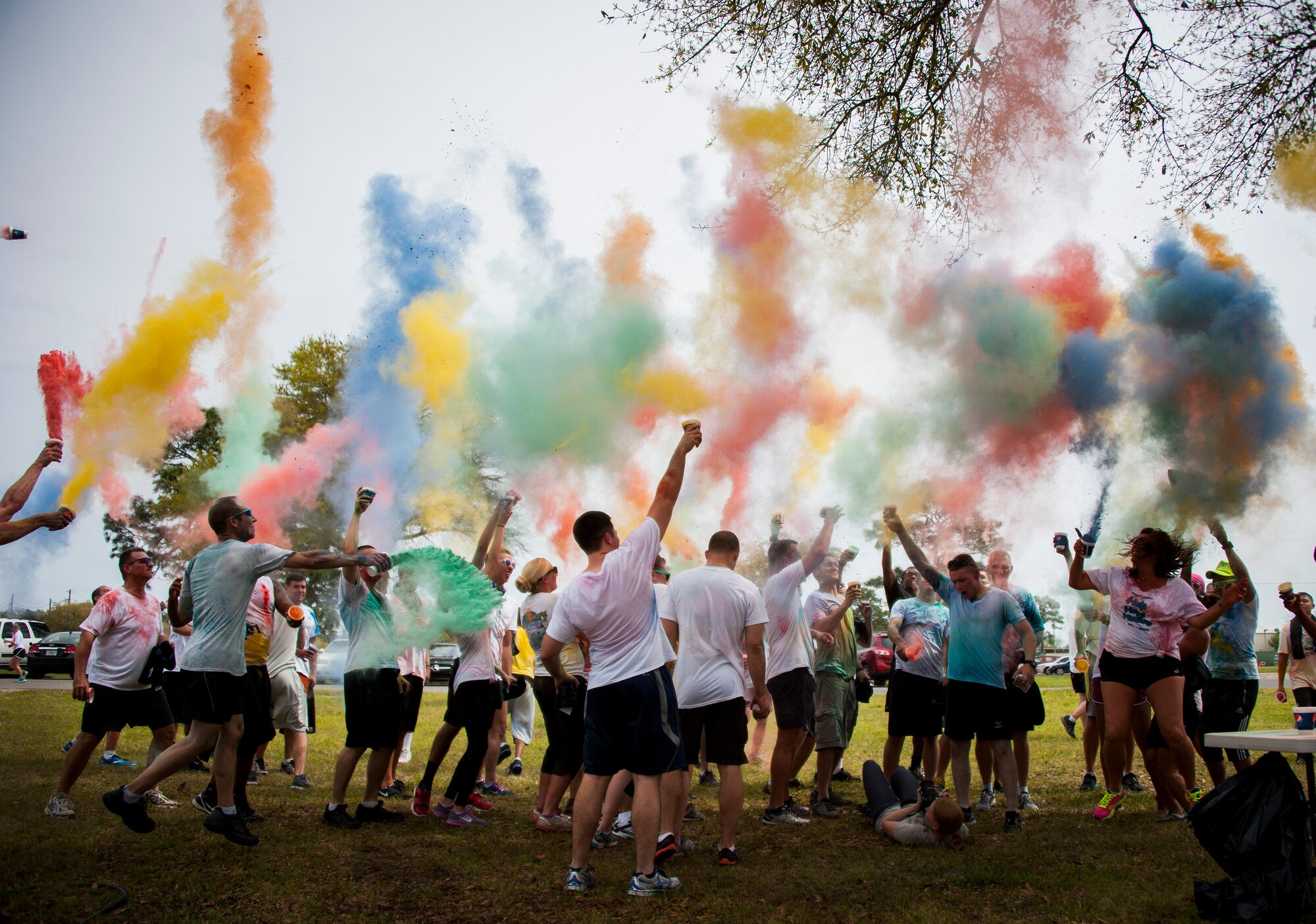 Participants get colorful during the Color Me Aware fun run April 4, at Eglin Air Force Base, Fla.  Approximately 30 volunteers helped more than 450 participants get colorful during three color zones of the three-mile run.  The event highlighted the start of Sexual Assault Awareness Month. (U.S. Air Force photo/Sara Vidoni)