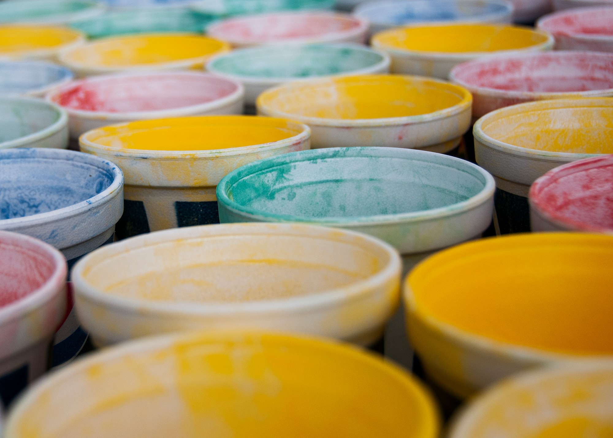 Cups of color are laid out on a table for participants to grab during the Color Me Aware fun run, April 4, at Eglin Air Force Base, Fla.  Approximately 30 volunteers helped more than 450 participants get colorful during three color zones of the three-mile run.  The event highlighted the start of Sexual Assault Awareness Month. (U.S. Air Force photo/Tech. Sgt. Jasmin Taylor)