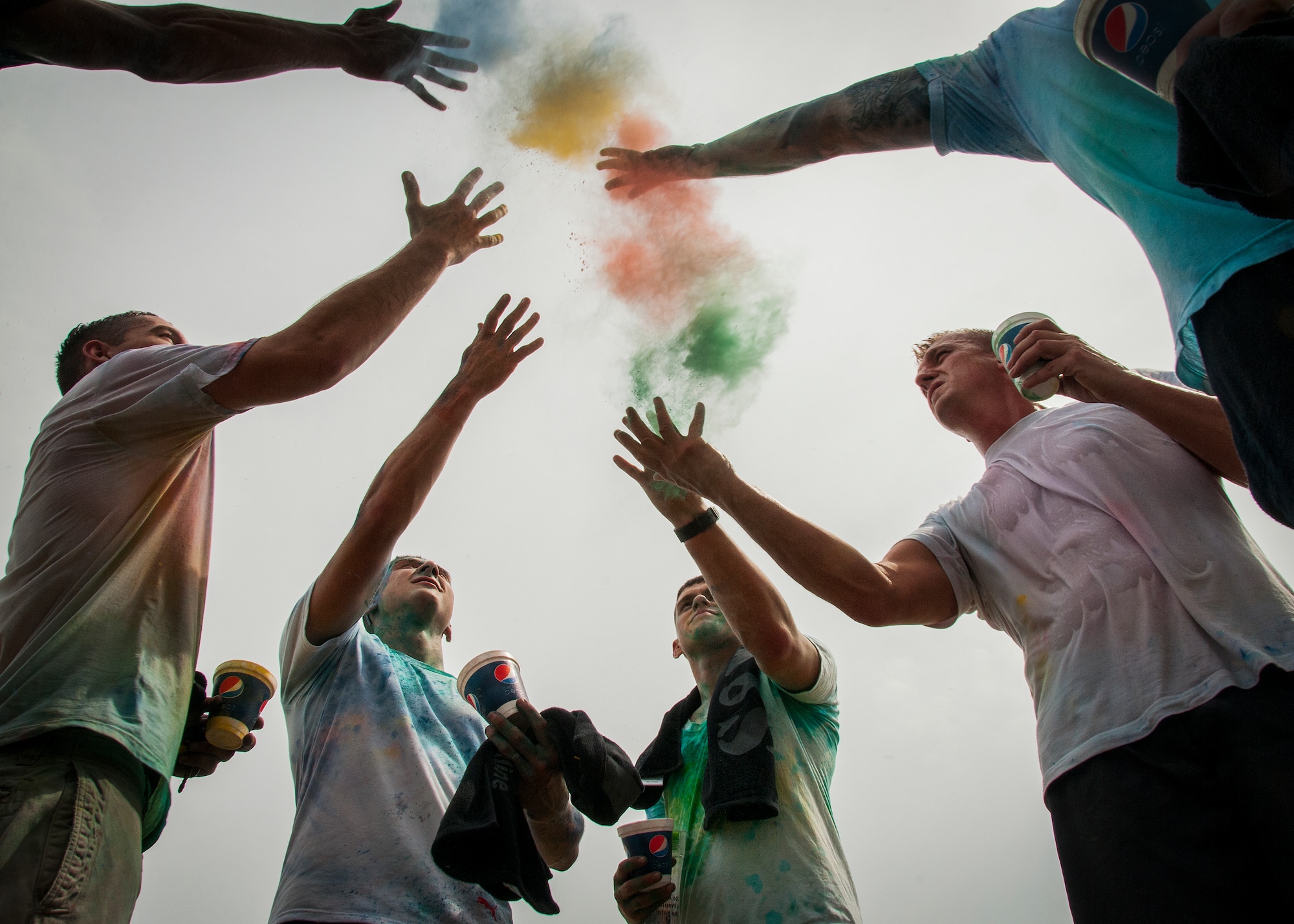 Participants get colorful during the Color Me Aware fun run April 4, at Eglin Air Force Base, Fla.  Approximately 30 volunteers helped more than 450 participants get colorful during three color zones of the three-mile run.  The event highlighted the start of Sexual Assault Awareness Month. (U.S. Air Force photo/Tech. Sgt. Jasmin Taylor)