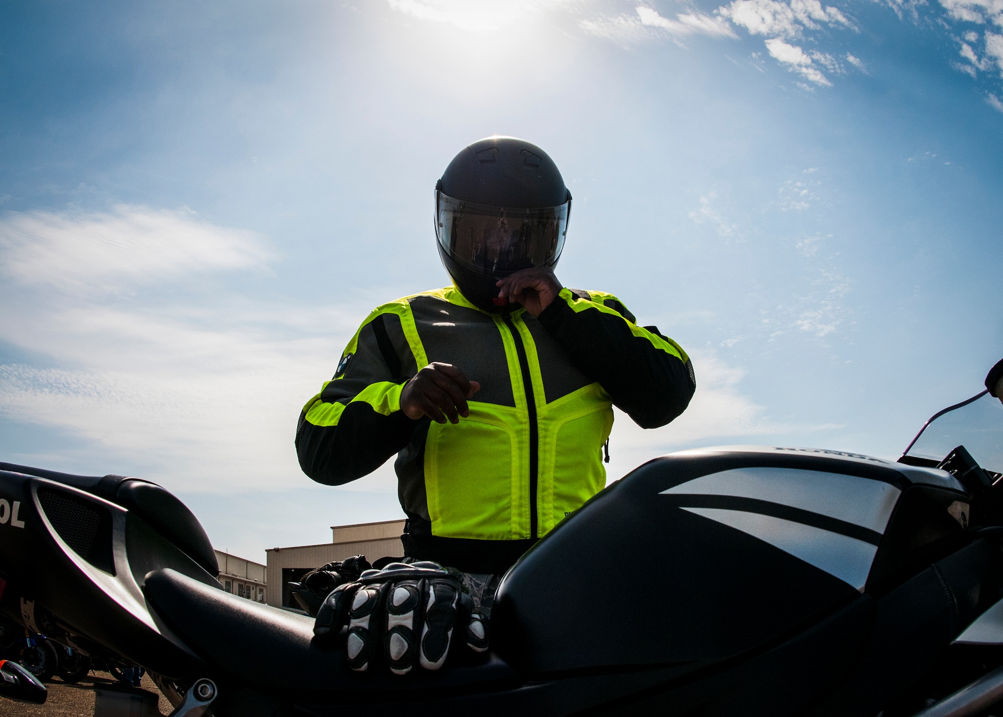 A rider ensures his helmet is securely fastened before preparing to ride out after attending the seventh annual motorcycle safety rally April 4, at Eglin Air Force Base, Fla.  More than 450 bikers attended to hear briefings on motorcycle law, safety regulations and tips on how to be more informed and aware rider.  (U.S. Air Force photo/Tech. Sgt. Jasmin Taylor)