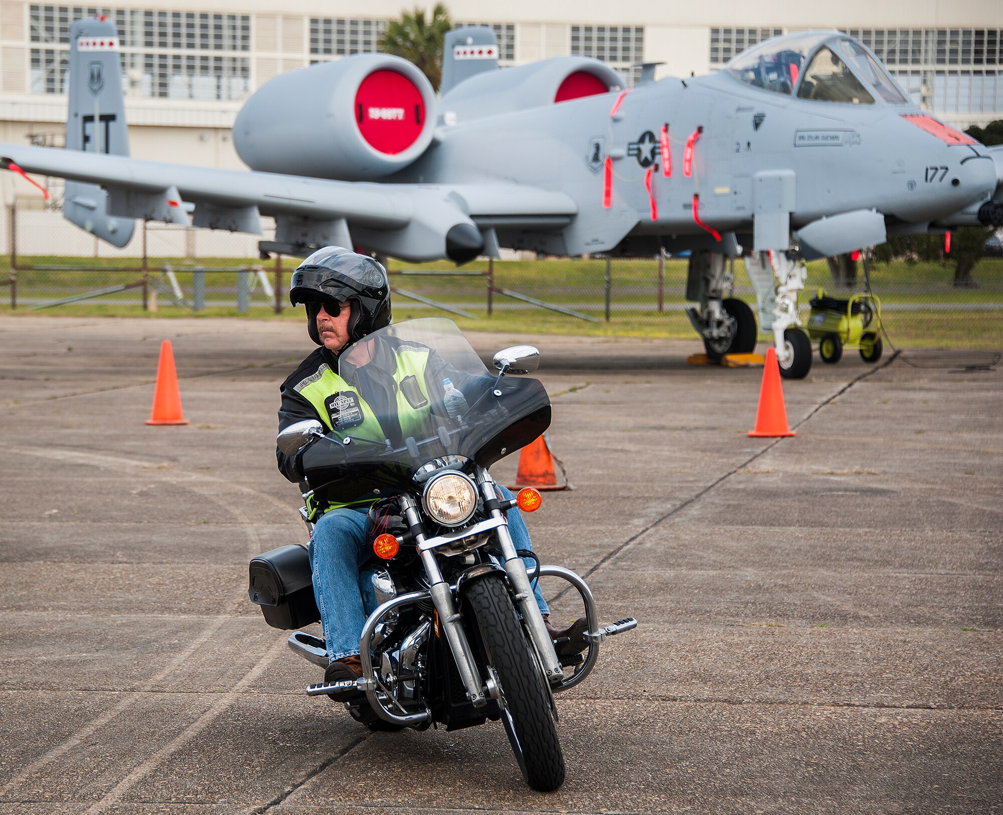 A motorcyclist pulls into the seventh annual motorcycle safety rally April 4, at Eglin Air Force Base, Fla.  More than 450 bikers attended to hear briefings on motorcycle law, safety regulations and tips on how to be more informed and aware rider.  (U.S. Air Force photo/Sara Vidoni)