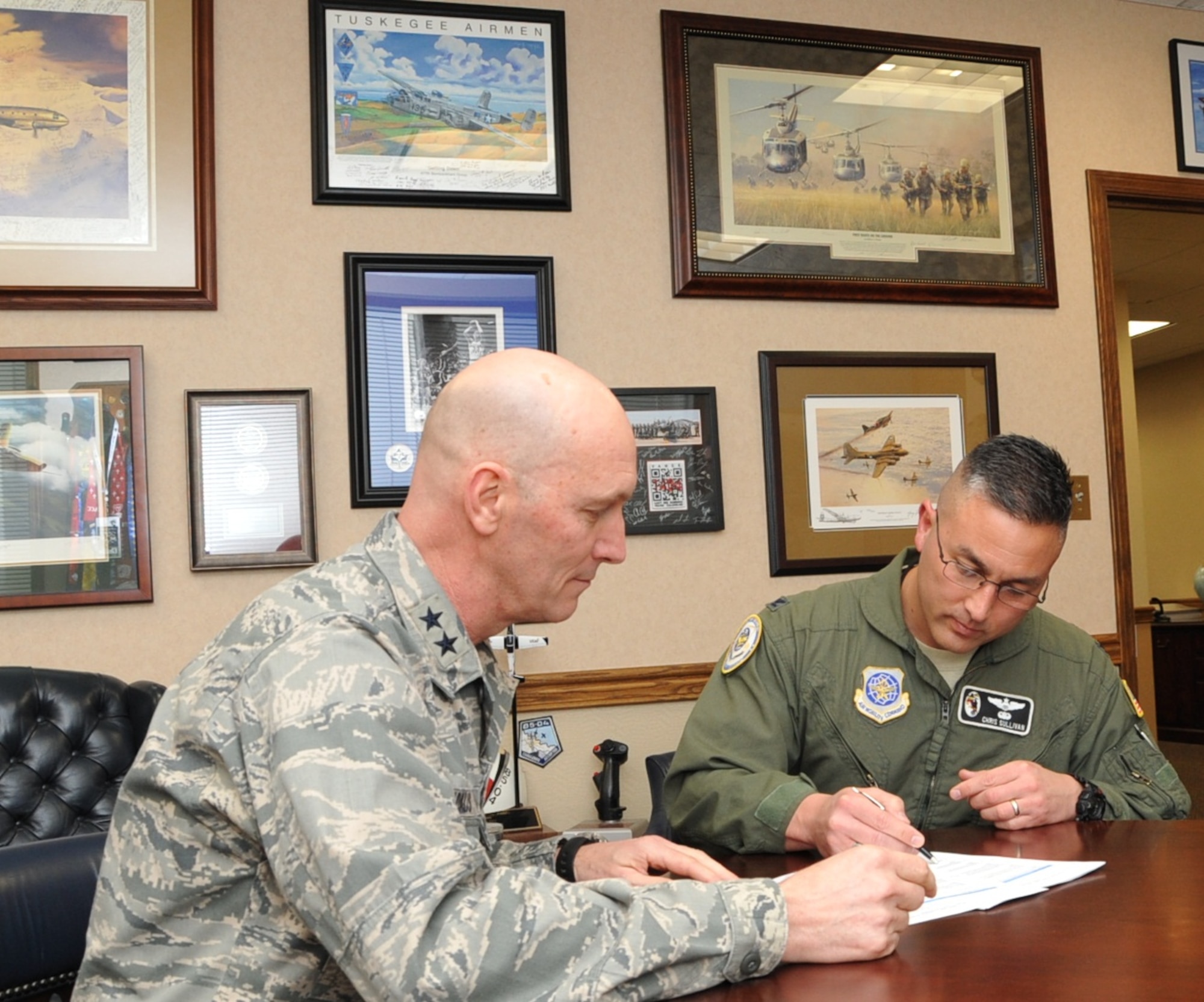 Col. Christopher Sullivan, Air Mobility Command Inspection General Team Chief, interviews Maj. Gen. Timothy Zadalis, 618th AOC commander, March 28, 2014, during AMC's inspection of the AOC at Scott Air Force Base, Ill. The 618th AOC was the first AOC inspected under the new system. 
