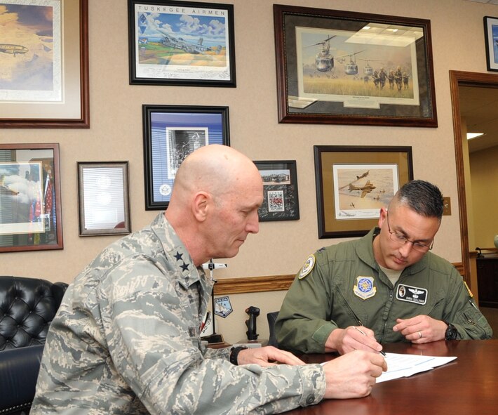 Col. Christopher Sullivan, Air Mobility Command Inspection General Team Chief, interviews Maj. Gen. Timothy Zadalis, 618th AOC commander, March 28, 2014, during AMC's inspection of the AOC at Scott Air Force Base, Ill. The 618th AOC was the first AOC inspected under the new system. 
