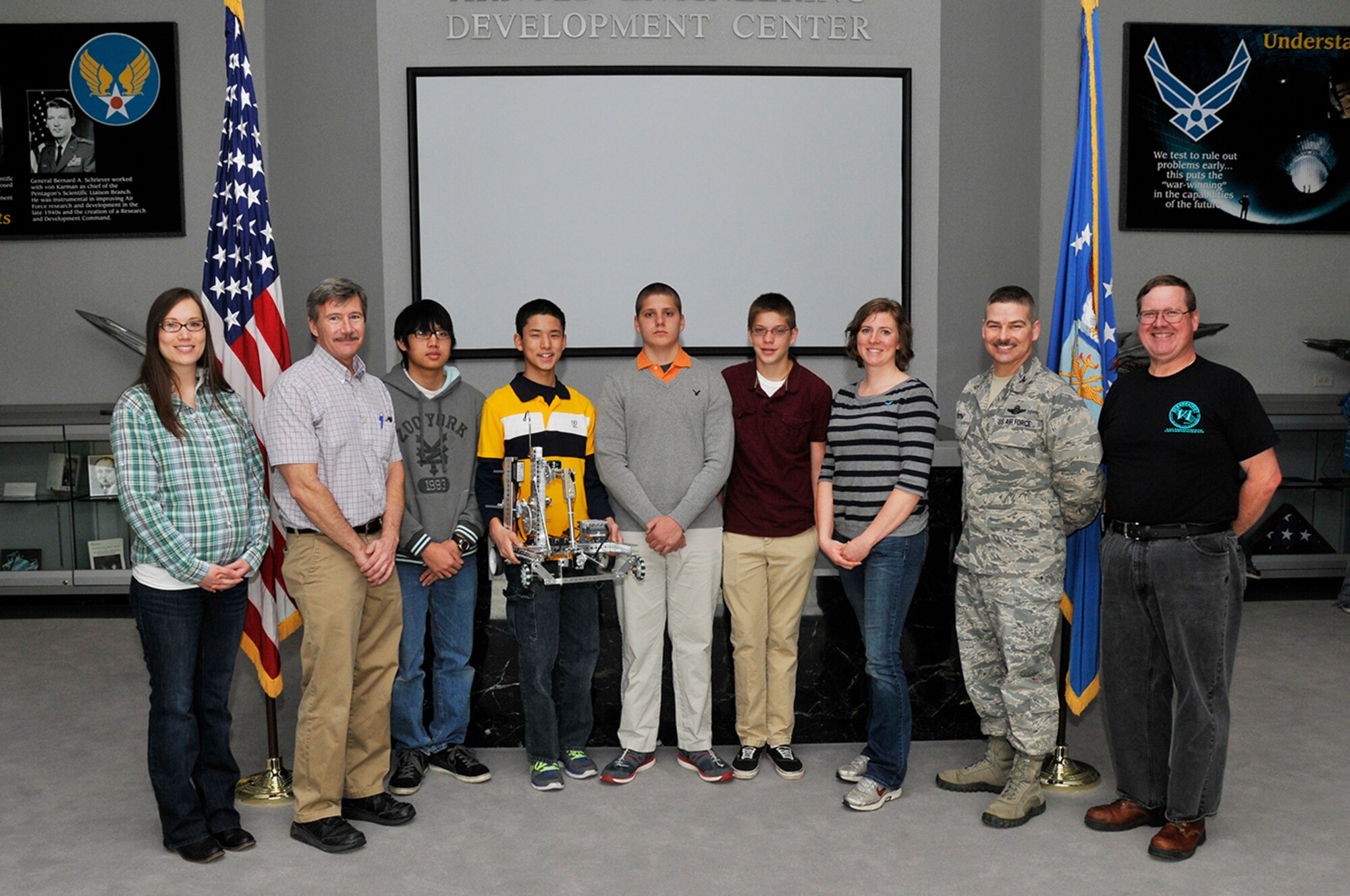 Arnold Engineering Development Complex (AEDC) Commander Col. Raymond Toth congratulates the Tullahoma High School FIRST Tech Challenge (FTC) Team for their participation in the FTC STEM program. Pictured left to right is FTC Coach/Teacher Mai-Li Miller, AEDC Mentor Troy Bisby, students Kevin Nguyen, Alec Yen, Dalton Baker, Dakota Baker, FTC Coach/Teacher McKenzi Fanning, Toth and AEDC Mentor Michael Glennon.