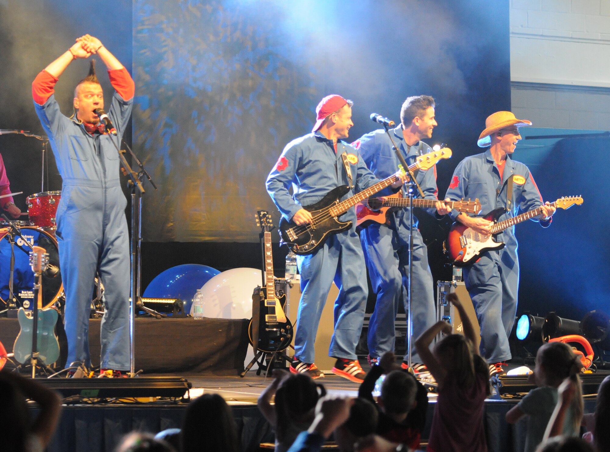 The Imagination Movers, from left, Scott Durbin, Dave Poche, Rich Collins and Scott “Smitty” Smith, perform April 4, 2014at RAF Midenhall, England. The performance featured original songs from the group as well as popular covers. (U.S. Air Force photo by Tech. Sgt. Neal X. Joiner/Released)