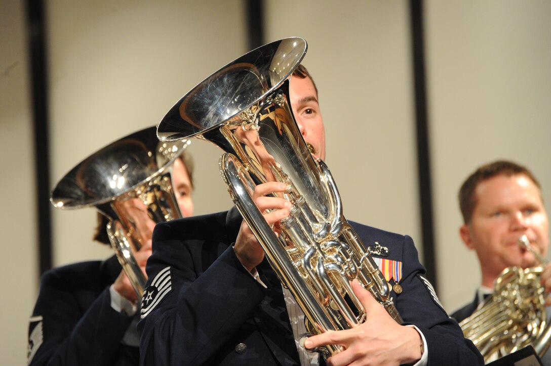 Tech. Sgt. Joseph M. Bello performs during a concert featuring the U.S. Air Force Band’s Concert Band and the Singing Sergeants at his alma mater, Neuqua Valley High School, in Naperville, Ill., April 5, 2014. In addition to his performance duties as an euphoniumist, Bello is director of tours for the Concert Band.. Before joining the Air Force, Bello was a soloist with the University of Texas Symphonic Band, the Dallas Wind Symphony and the Chicago Symphony Orchestra. (U.S. Air Force photo/Master Sgt. Tammie Moore)