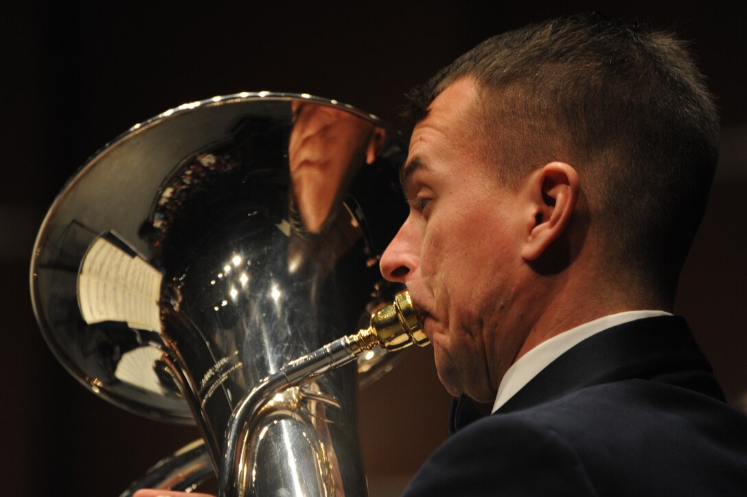 Tech. Sgt. Joseph M. Bello performs during a concert featuring the U.S. Air Force Band’s Concert Band and the Singing Sergeants at the College of DuPage in Glen Ellyn, Ill., April 4, 2014. In addition to his performance duties as an euphoniumist, Bello is the director of Concert Band tours.(U.S. Air Force photo/Master Sgt. Tammie Moore)