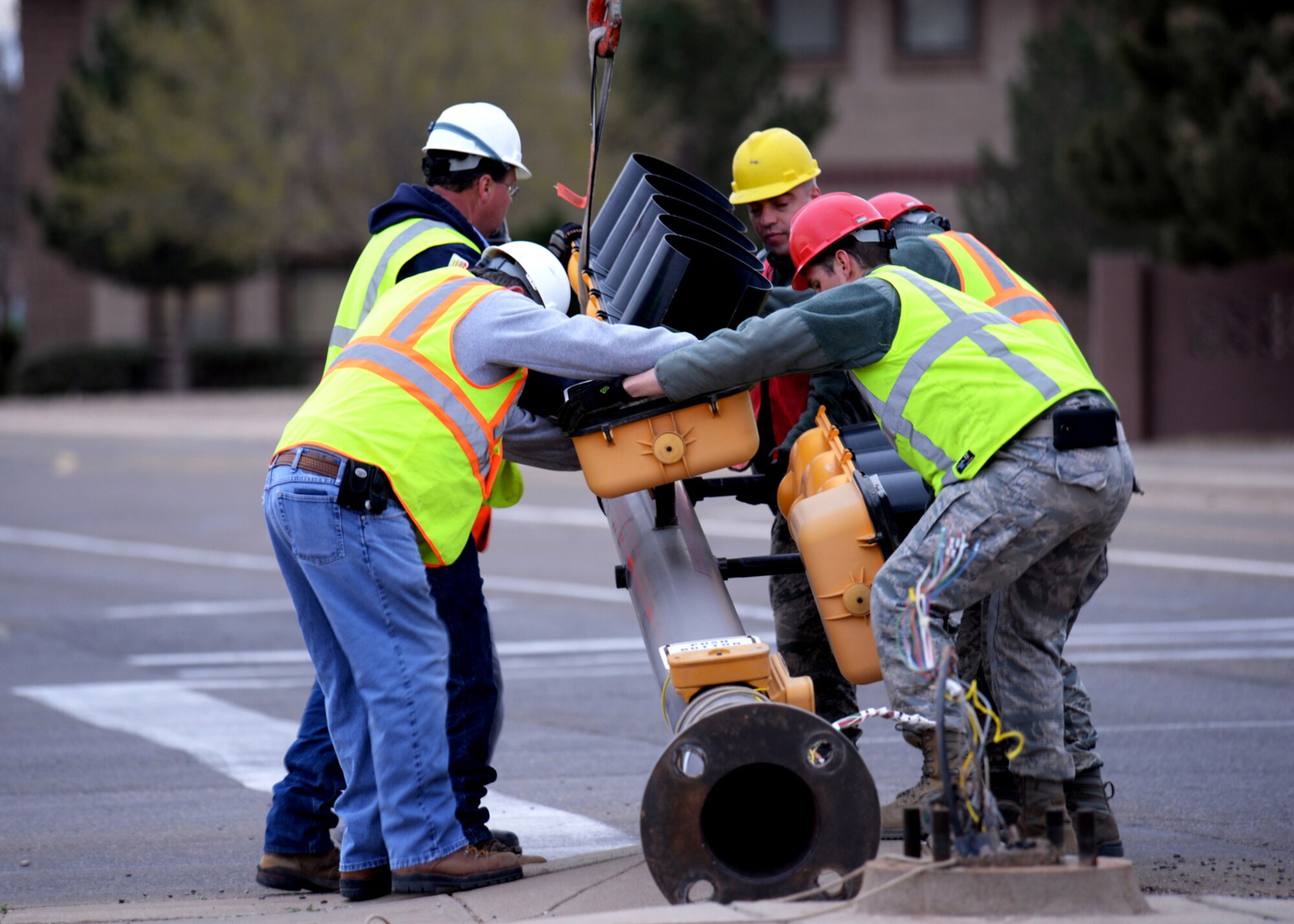 Traffic lights had to be disconnected and removed on April 6, 2014 at Cannon Air Force Base, N.M., in preparation for the relocation of an AC-130H Spectre gunship. In order to support the massive wingspan, potential obstacles had been to be planned for accordingly. (U.S. Air Force photo/Airman 1st Class Chip Slack)