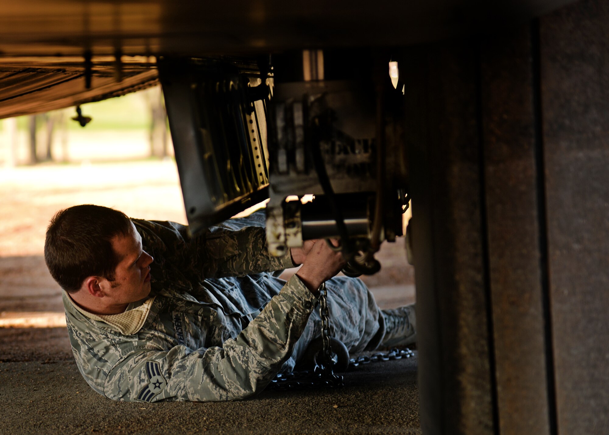 A 27th Special Operations Civil Engineer airman properly secures an AC-130H Spectre gunship to its new home at the Air Park on April 6, 2014 at Cannon Air Force Base, N.M. The historical aerial asset will be the newest addition to the Air Park, to be memorialized for generations to come. (U.S. Air Force photo/Airman 1st Class Chip Slack)