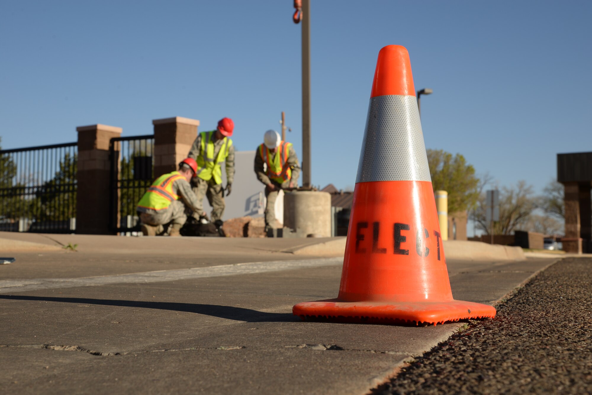 Members of the 27th Special Operations Civil Engineer Squadron remove lights in anticipation for the addition of an AC-130H Spectre gunship to the Air Park on April 5, 2014 at Cannon Air Force Base, N.M.  The gunship had to seamlessly make its way from the flightline, all the way to the main gate. (U.S. Air Force photo/Airman 1st Class Chip Slack)