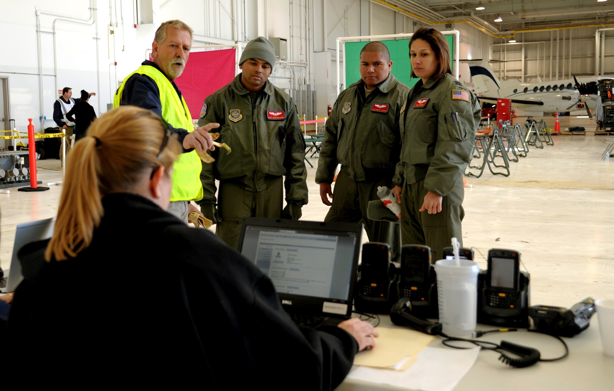 Members assigned to the 375th Aeromedical Evacuation Squadron, learn about the patient tracking system TRACES during a national disaster exercise, Ultimate Caduceus 2014, at Denver, Colo., March 31, 2014. During Ultimate Caduceus, part of the Federal Emergency Management Agency’s National Capstone Exercise, AE members provided medical support, processed and transferred patients. Utlimate Caduceus 14 illustrates the critical partnership between Mobility Air Forces and the interagency, in this case FEMA, by exercising disaster relief operations. The aeromedical teams were comprised of more than 18 AE crew members from Pope Army Airfield, N.C., Scott AFB, Il., and Cheyenne ANG base, Wyo. (U.S. Air Force photo/ Staff Sgt. Stephenie Wade)