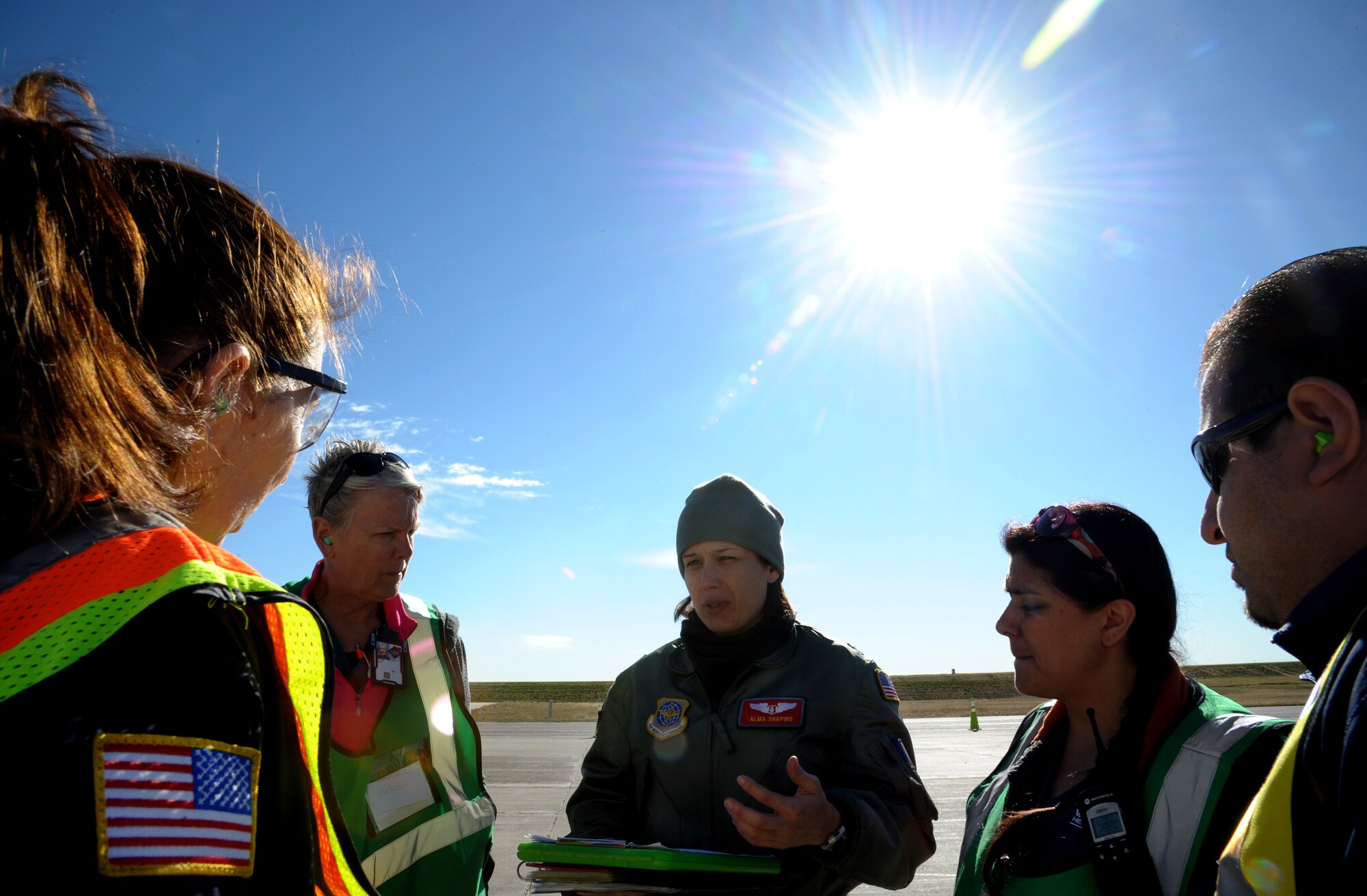 Capt. Alma Shapiro, 375th Aeromedical Evacuation Squadron flight nurse, informs litter carry volunteers of unloading instructions during a national disaster exercise, Ultimate Caduceus 2014, at Cheyenne Air National Guard Base, Wyo., March 31, 2014. During Ultimate Caduceus, part of the Federal Emergency Management Agency’s National Capstone Exercise, AE members provided medical support processed and transferred patients. The aeromedical teams were comprised of more than 18 AE crew members from Pope Army Airfield, N.C., Scott AFB, Ill., and Cheyenne ANG base, Wyo. (U.S. Air Force photo/ Staff Sgt. Stephenie Wade)