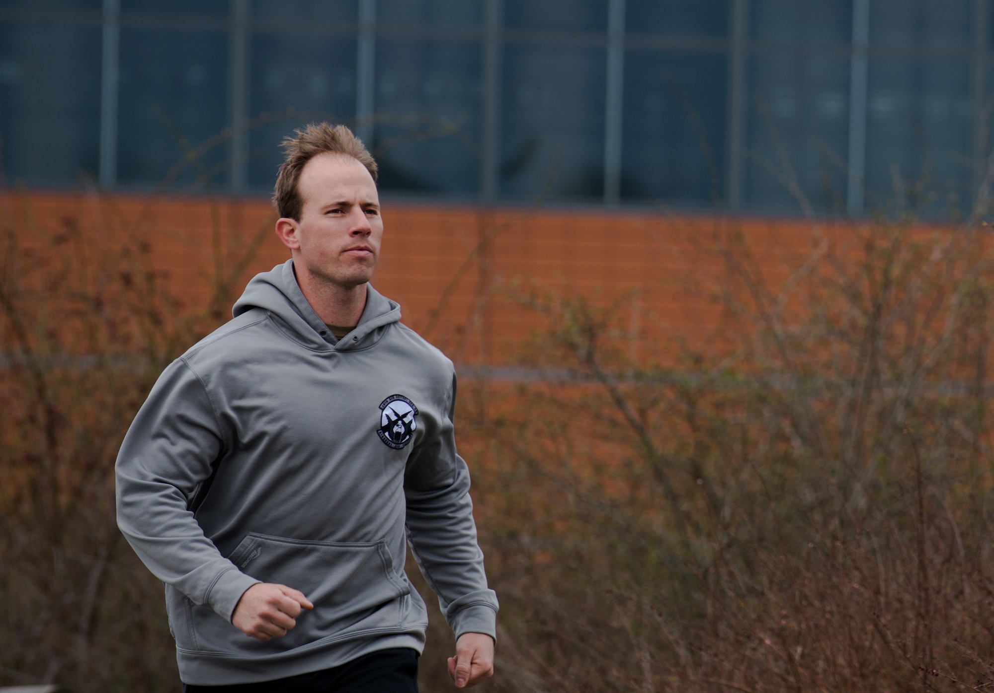 Staff Sgt. Mike Starnes, 2nd Air Support Operations Squadron joint terminal attack controller, runs during a memorial event March 28, 2014, at Grafenwoehr, Germany. On March 27 and 28 the 2nd ASOS organized and participated in a 24-hour run where they spent time with family and friends in memory of fallen tactical air control party Airmen. (U.S. Air Force photo/Senior Airman Jonathan Stefanko)