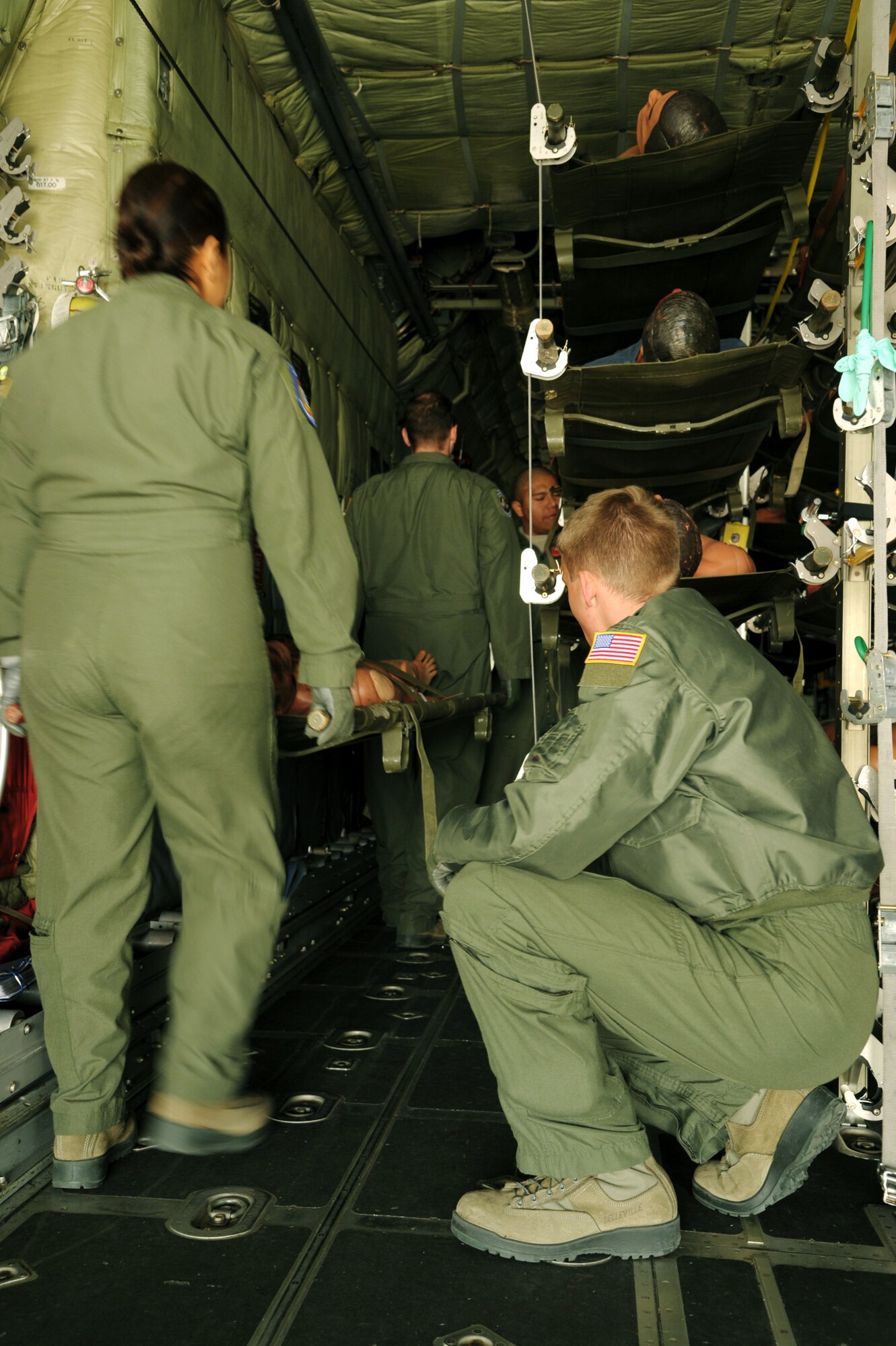 Aeromedical Evacuation members load simulated litter patients onto a C-130 during a national disaster exercise, Ultimate Caduceus 2014, at Cheyenne Air National Guard Base, Wyo., March 30, 2014. During Ultimate Caduceus, part of the Federal Emergency Management Agency’s National Capstone Exercise, AE members provided medical support processed and transferred patients. The aeromedical teams were comprised of more than 18 AE crew members from Pope Army Airfield, N.C., Scott AFB, Il., and Cheyenne ANG base, Wyo. (U.S. Air Force photo/ Staff Sgt. Stephenie Wade)