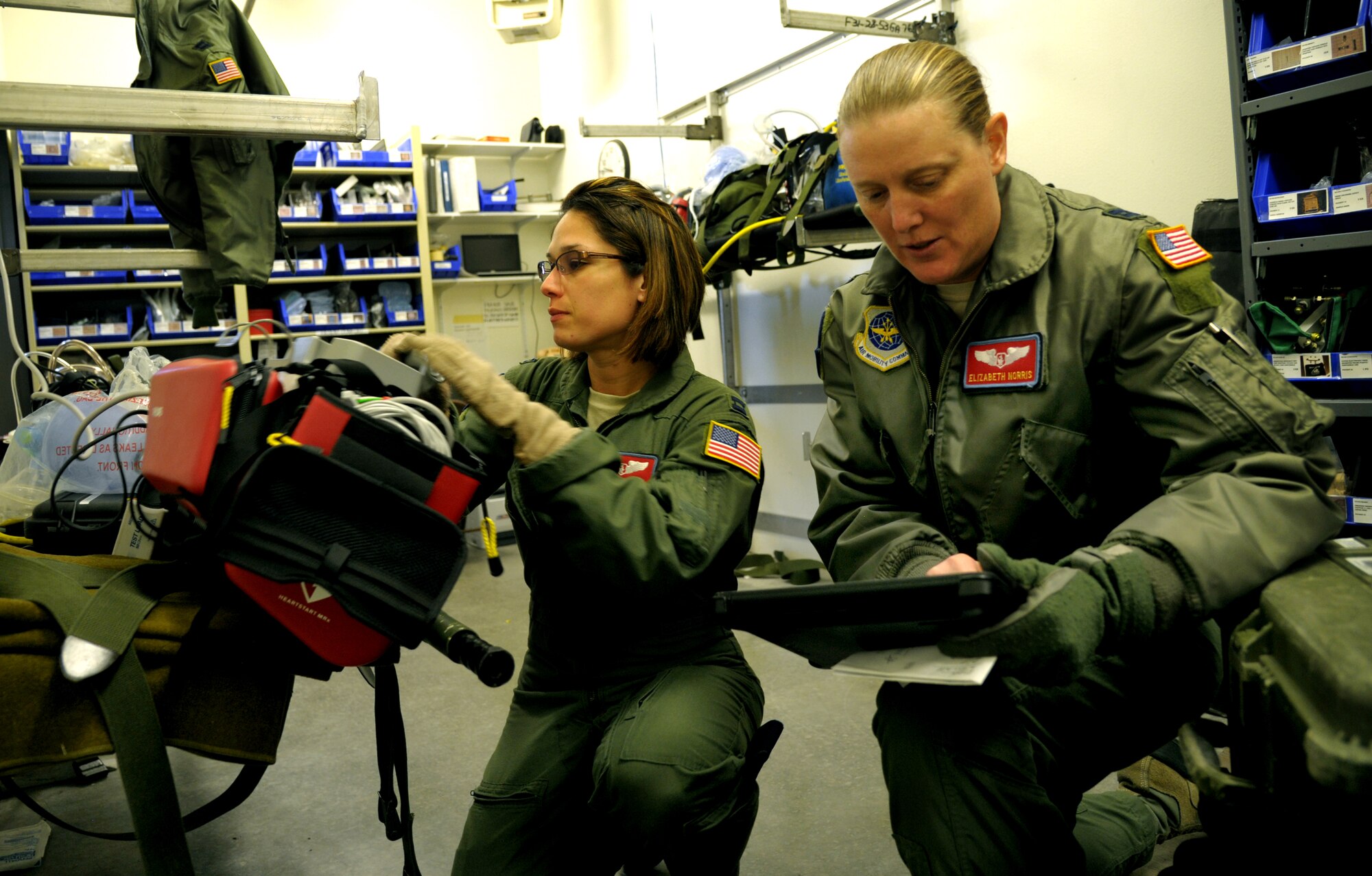 (Left to Right) Capt. Alma Sharpiro and Elizabeth Norris, 375th Aeromedical Evacuation Squadron flight nurses prepare and inspect medical equipment during a national disaster exercise, Ultimate Caduceus 2014, at Cheyenne ANG Base, Wyo., March 30, 2014. During Ultimate Caduceus, part of the Federal Emergency Management Agency’s National Capstone Exercise, AE members provided medical support, processed and transferred patients. The aeromedical teams were comprised of more than 18 AE crew members from Pope Army Airfield, N.C., Scott AFB, Ill., and Cheyenne ANG base, Wyo. (U.S. Air Force photo/ Staff Sgt. Stephenie Wade)