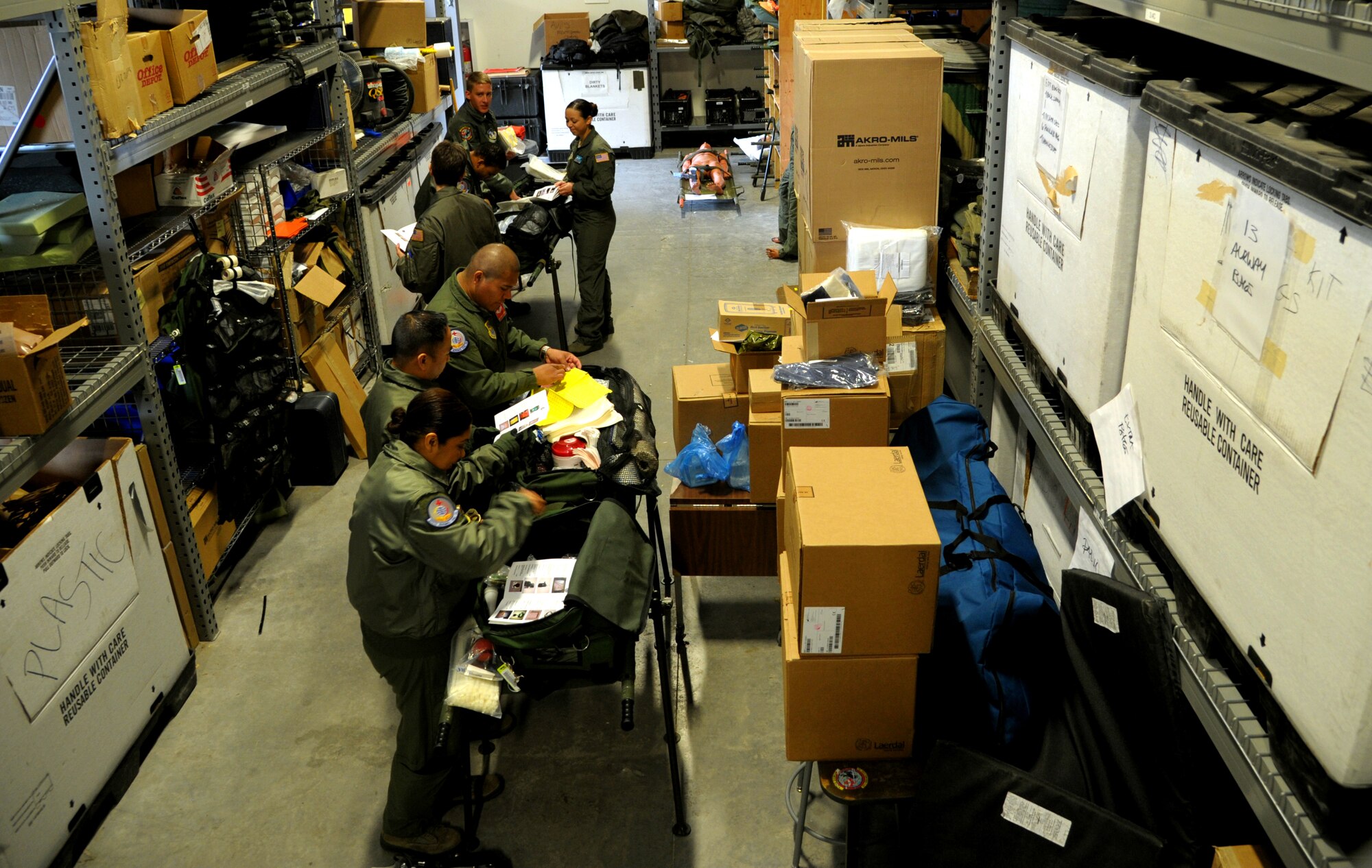 Aeromedical Evacuation members prepare and inspect medical supplies during a national disaster exercise, Ultimate Caduceus 2014, at Cheyenne Air National Guard Base, Wyo., March 30, 2014. During Ultimate Caduceus, part of the Federal Emergency Management Agency's National Capstone Exercise, AE members provided medical support processed and transferred patients. The aeromedical teams were comprised of more than 18 AE crew members from Pope Army Airfield, N.C., Scott AFB, Ill., and Cheyenne ANG Base, Wyo. (U.S. Air Force photo/ Staff Sgt. Stephenie Wade) 