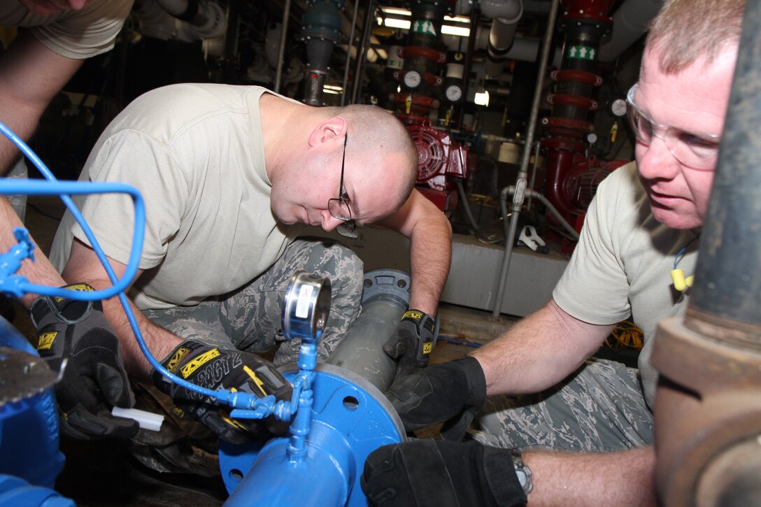 During a special joint project on base, members from the Air Force Reserve and active duty spent time training together. The 375 CES operations flight worked with members from the 932 CES operations flight to install a 4" duplex domestic water booster pump, 3" isolation valve, and rebuild a 4" backflow preventer. 932nd CE office (U.S. Air Force photo/Tech Sgt. Christopher Parr) 