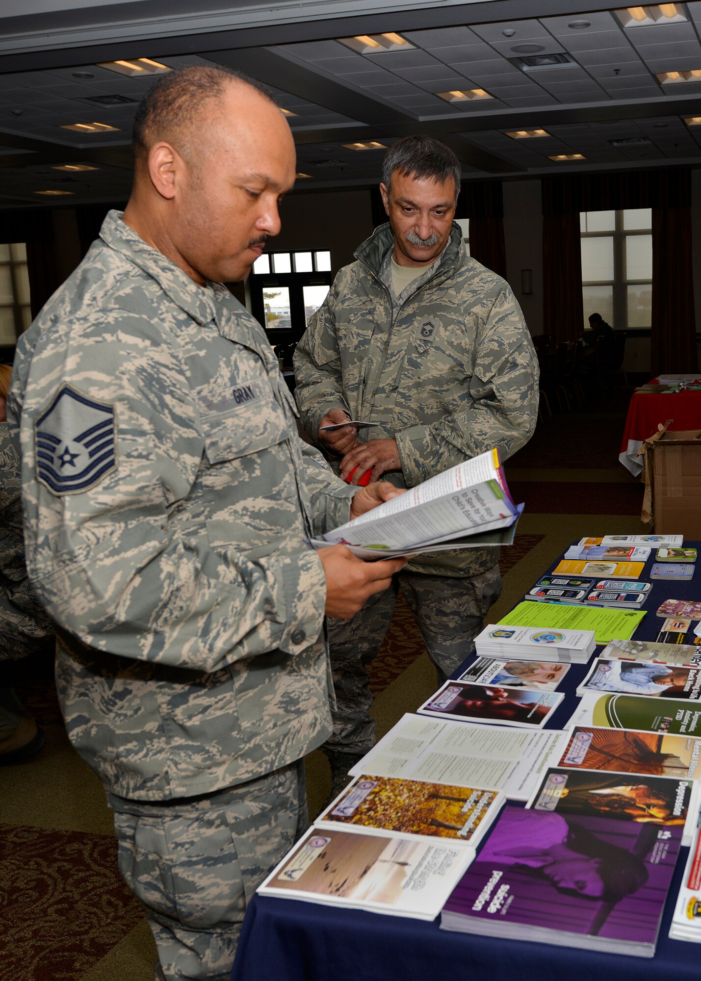 914th Airlift Wing Airmen view information provided by the Air Force Reserve Psychological Health Advocate Program at the Niagara Falls Air Reserve Station Community Activity Center, April 4, 2014. PHAP is a free and confidential resource provider specifically for Air Force Reservists. Some areas that PHAP assists the reservists and families with are family counseling, child and teenager concerns, marriage retreats, alcohol and substance abuse, suicide prevention, mental health issues, Post Traumatic Stress Disorder, anger management, and domestic violence. (U.S. Air Force photo by Tech. Sgt. Joseph McKee)