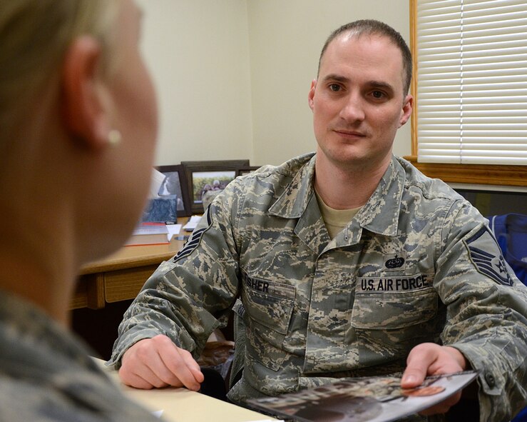 HANSCOM AIR FORCE BASE, Mass. – Master Sgt. John E. Fisher, 66th Air Base Group career assistance advisor, meets with Senior Airman Samantha Filgerleski, C3I and Networks Directorate knowledge operations manager, at the Educations Center April 2 to discuss reenlistment options available to her. The career assistance advisor provides programs that assist Airmen with career opportunities and provide advanced leadership tools such as Palace Chase, cross-training and more. (U.S. Air Force photo by Mark Wyatt)