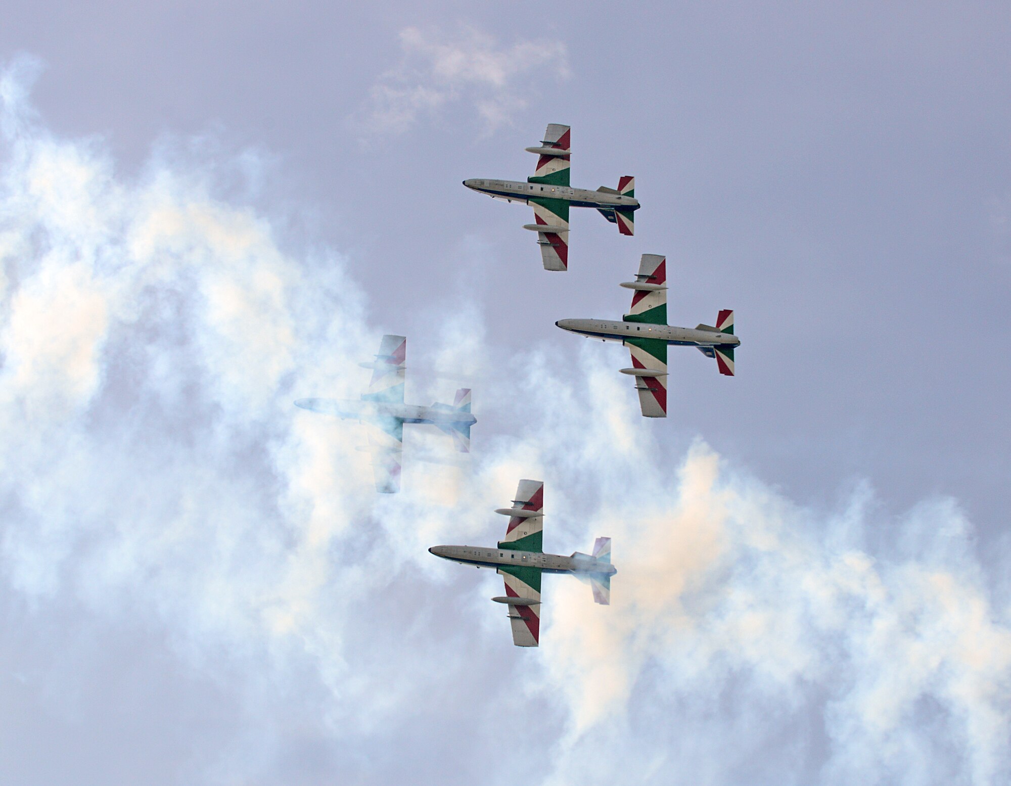 To kick off their 2014 tour, the Italian aerobatic demonstration team, Frecce Tricolori, performed numerous tricks and stunts above Aviano Air Base, Italy, during a pre-tour rehearsal, April 4, 2014. Formed in 1961, the group is the Italian air force’s premiere aerobatic team. (U.S. Air Force photo/Senior Airman Michael Battles) 