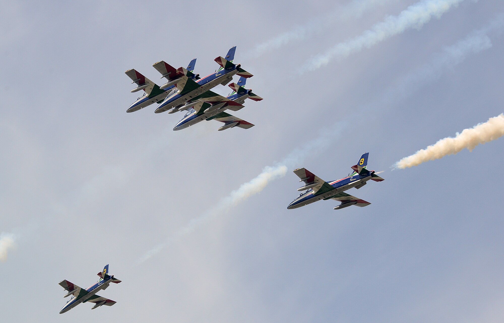 To kick off their 2014 tour, the Italian aerobatic demonstration team, Frecce Tricolori, performed numerous tricks and stunts above Aviano Air Base, Italy, during a pre-tour rehearsal, April 4, 2014. Each year, the team uses the space above Aviano to practice their show routine before departing on their tour. (U.S. Air Force photo/Senior Airman Michael Battles) 
