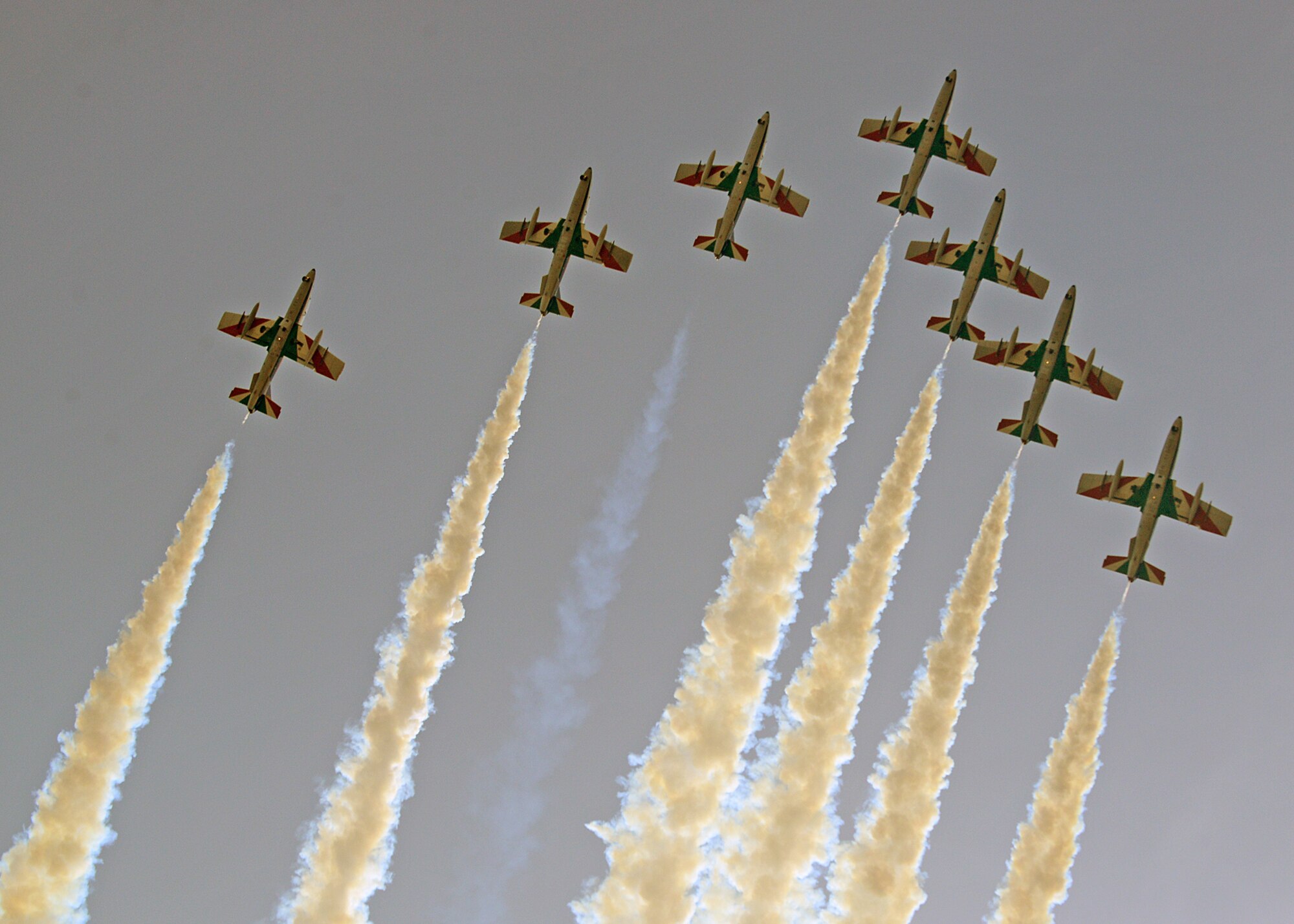 To kick off their 2014 tour, the Italian aerobatic demonstration team, Frecce Tricolori, performed numerous tricks and stunts above Aviano Air Base, Italy, during a pre-tour rehearsal, April 4, 2014. Each year, the team uses the space above Aviano to practice their show routine before departing on their tour. (U.S. Air Force photo/Senior Airman Michael Battles) 