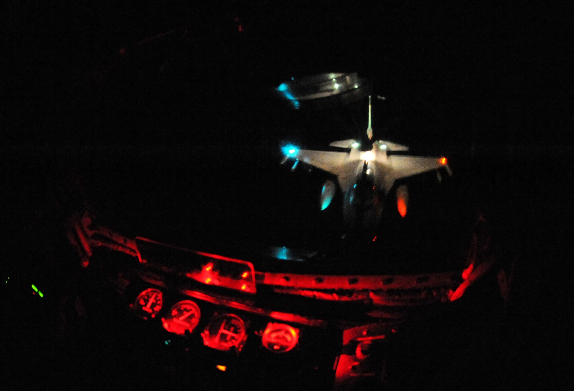 U.S. Air Force Staff Sgt. Chad Halloway, 909th Air Refueling Squadron boom operator, guides a Republic of Korea F-16 to the boom of a KC-135 Stratotanker over the Asian-Pacific region April 1, 2014, in preparation for the Red Flag exercise in Alaska. Red Flag-Alaska is a series of Pacific Air Forces commander-directed field training exercises for U.S. forces, provides joint offensive counter-air, interdiction, close air support, and large force employment training in a simulated combat environment. (U.S. Air Force photo by Airman 1st Class Keith James)