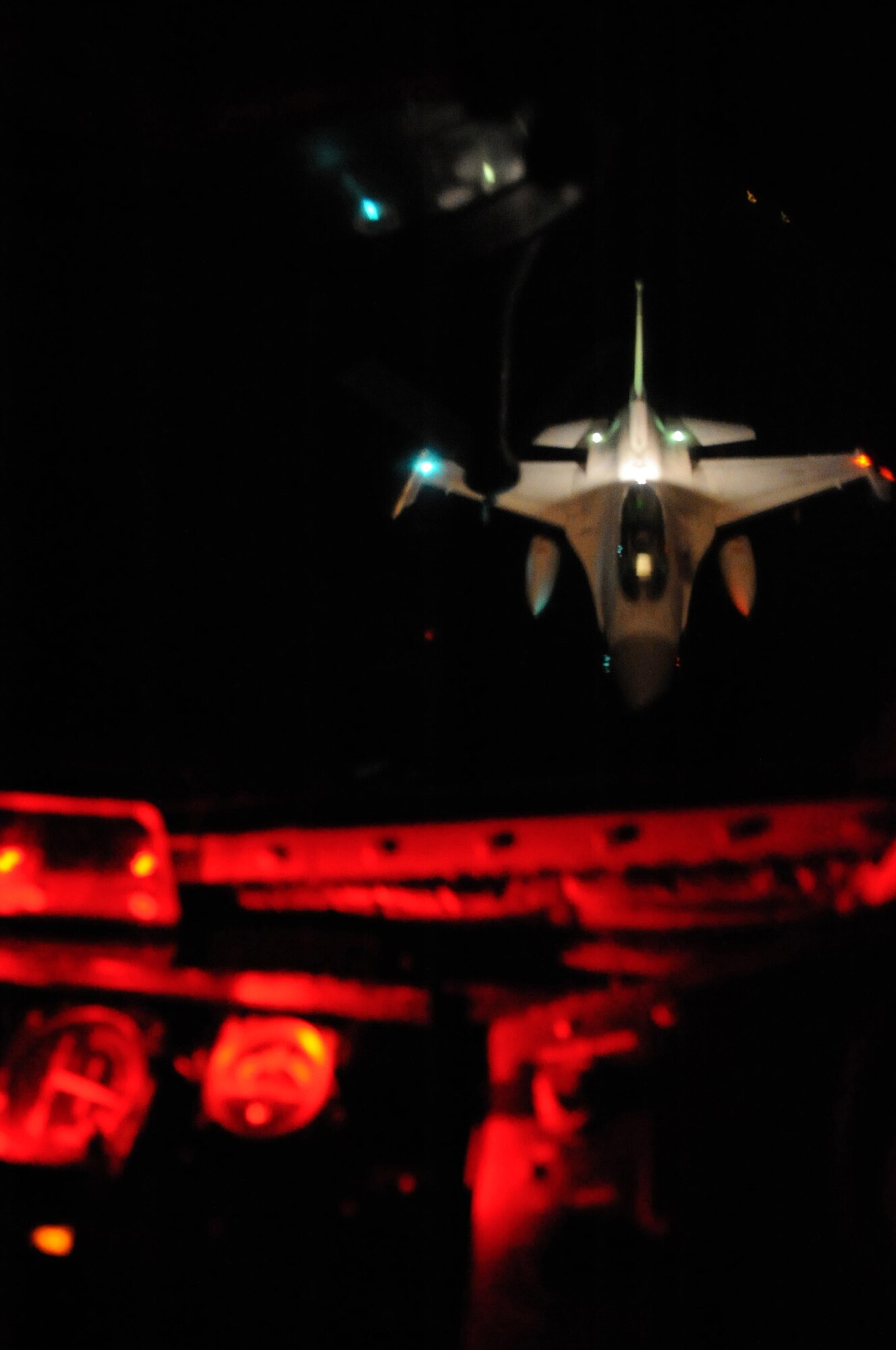 U.S. Air Force Staff Sgt. Chad Halloway, 909th Air Refueling Squadron boom operator, guides a Republic of Korea F-16 to the boom of a KC-135 Stratotanker over the Asian-Pacific region April 1, 2014, in preparation for the Red Flag exercise in Alaska. Red Flag-Alaska is a series of Pacific Air Forces commander-directed field training exercises for U.S. forces, provides joint offensive counter-air, interdiction, close air support, and large force employment training in a simulated combat environment. (U.S. Air Force photo by Airman 1st Class Keith James)