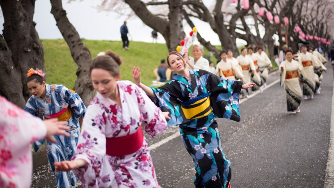 Kat Van Pixteren, a Yokota Air Base spouse performs a tanabata dance in a traditional Japanese Yukata outfit during the Fussa Sakura Festival in Fussa City, Japan, April 6, 2014. Yokota’s Tanabata Dancers perform at local festivals in order to promote goodwill and cultural exchange between the U.S. and Japan. (U.S. Air Force photo by Capt. Raymond Geoffroy)