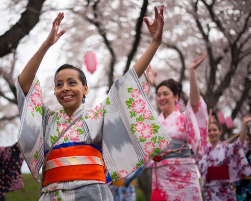 Arlen Paola, a Yokota Air Base spouse performs a tanabata dance in a traditional Japanese Yukata outfit during the Fussa Sakura Festival in Fussa City, Japan, April 6, 2014. Yokota’s Tanabata Dancers perform traditional Japanese dances during festivals in the local community throughout the year. (U.S. Air Force photo by Capt. Raymond Geoffroy)