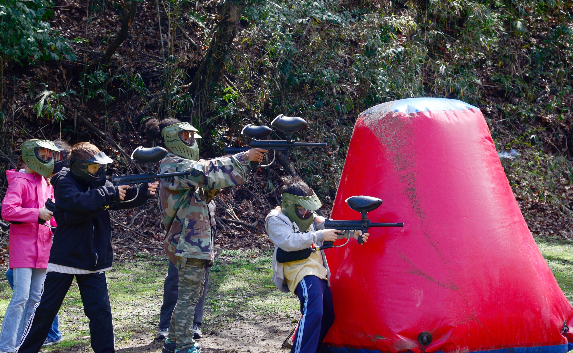 Children participate in a paintball match at Tama Hills, Japan, April 4, 2014, as part of Kids Understanding Deployment Operations support program.  The event was organized to educate service member’s children about the processes leading up to and during deployments. ( U.S. Air Force photo by Tech Sgt. Melissa K. Mekpongsatorn/Released)