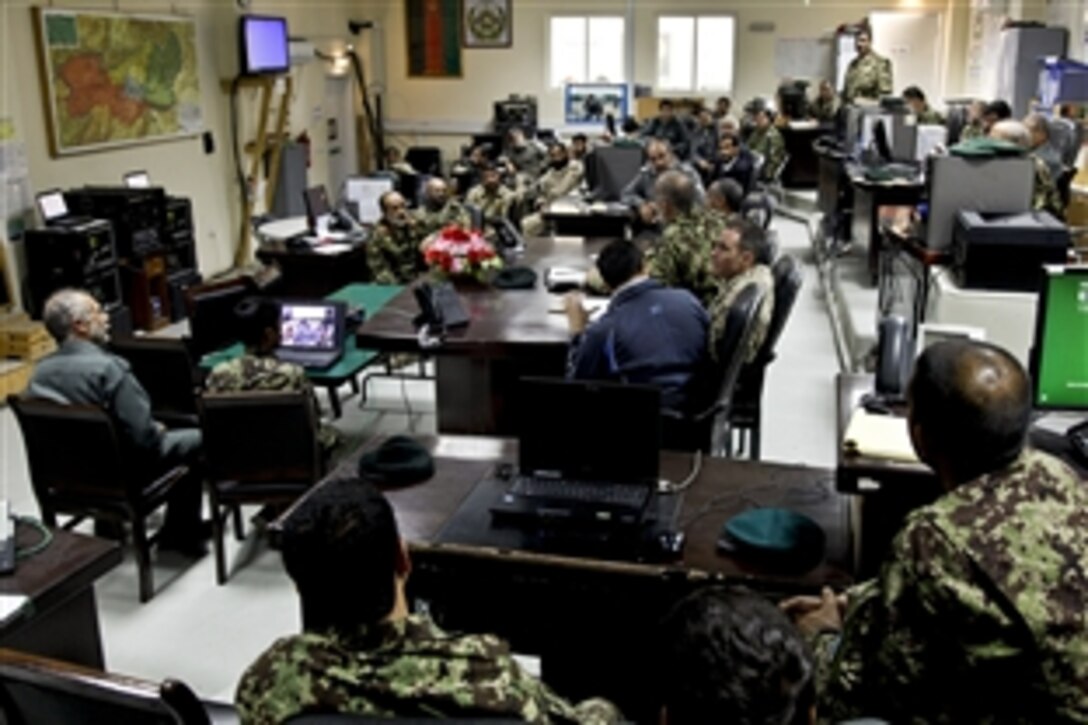 Afghan soldiers, Afghan national police, Afghan uniformed police, Afghan border police and U.S. soldiers conduct a briefing on Forward Operating Base Gamberi in Afghanistan's Laghman province, April 6, 2014. During the briefing, leaders congratulated everyone on their hard work during the Afghan presidential election the day before. The U.S. soldiers are assigned to the International Security Assistance Force, which assisted Afghan forces during the election.