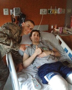 Airman 1st Class Alan Bauman visited his brother Jeff Bauman in a hospital. Jeff lost both his legs from the explosion near the finish line at the Boston Marathon. His book comes out April 8, 2014.
