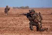 U.S. Marine Gunnery Sgt. Donnie Farmer, a Grants Pass, Ore., native serving with Georgia Liaison Team 10, Regional Command (Southwest), provides security during a combined Georgian-Marine security patrol near Combat Outpost Eredvi, Helmand province, Afghanistan, Nov. 5, 2013. Daily security patrols improved security around the base and connected base personnel with the concerns of local Afghans.(Photo By: Cpl. Paul Peterson)