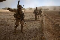 U.S. Marines with Bravo Company, 1st Battalion, 9th Marines (1/9) run towards a CH-53E Super Stallion assigned to Marine Heavy Helicopter Squadron 462 (HMH-462) at Gurjat Village, Helmand province, Afghanistan, Oct. 28, 2013. HMH-462 provided aerial support for 1/9 during an interdiction operation. (U.S. Marine Corps photo by Sgt. Gabriela Garcia/Released)