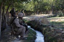 U.S. Marine Corps Staff Sgt. Alberto Boy, a platoon sergeant with India Company, 3rd Battalion, 7th Marine Regiment, kneels during a security patrol near Forward Operating Base Musa Qala, Helmand province, Afghanistan, Oct. 19, 2013. The Marines of 3/7 patrolled to reduce enemy activity in the area. (Official Marine Corps photo by Lance Cpl. James Mast / Released)